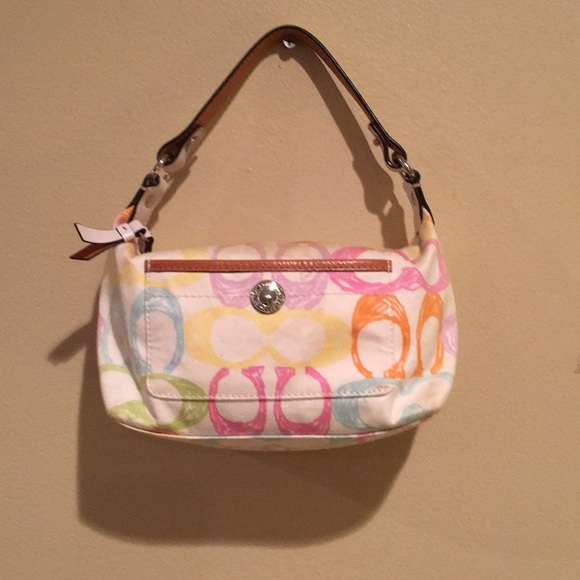 white coach purse with colored c's